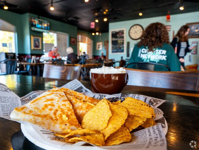 The Captain's Den serves Riverside locals chicken quesadilla and a quarterly charity drink.