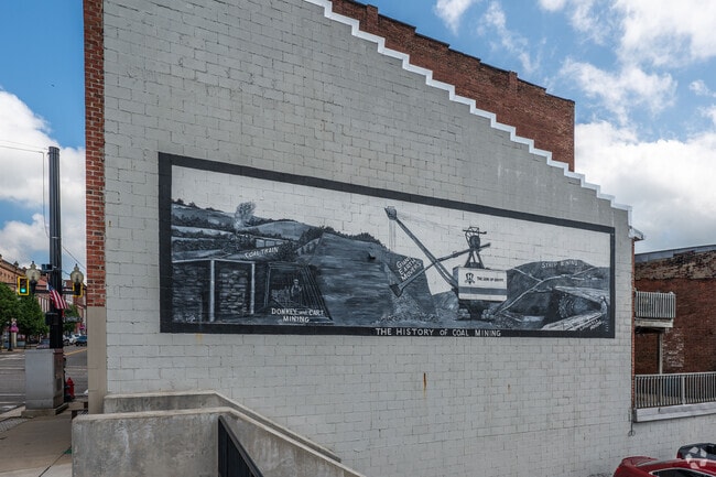 A mural depicting the coal industry is painted on the side of a downtown Barnesville building.