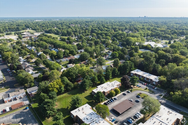 On a hot summer day, residents of Southwyck enjoy the shade of the surrounding tall trees.