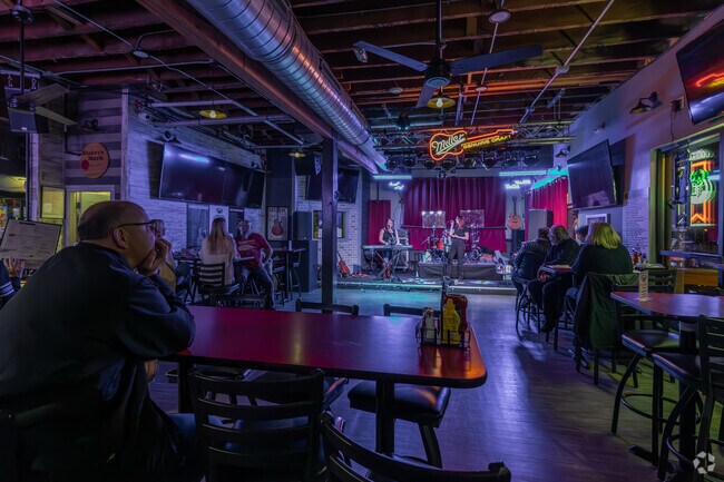 Watch local bands play or join the game-day excitement at Paulie's Pub in Henderson Park.