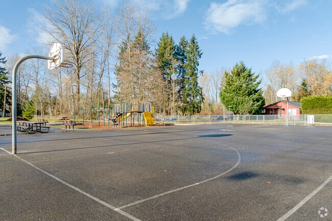 While the kids are on the playground, have a game of 2 on 2.