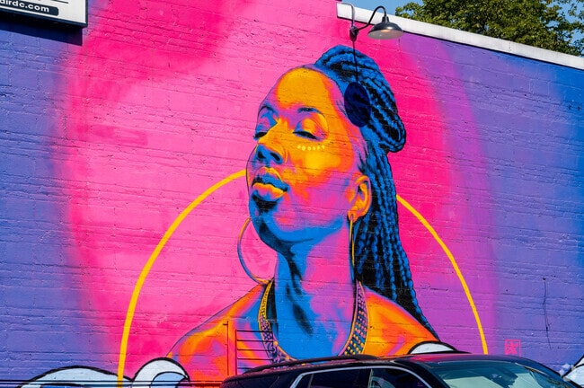 Tsunami Hair Studio features a bright, stunning mural in Benning Heights.