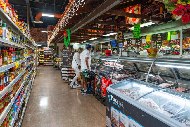 Shoppers browse fresh meats in Deerfield West markets.