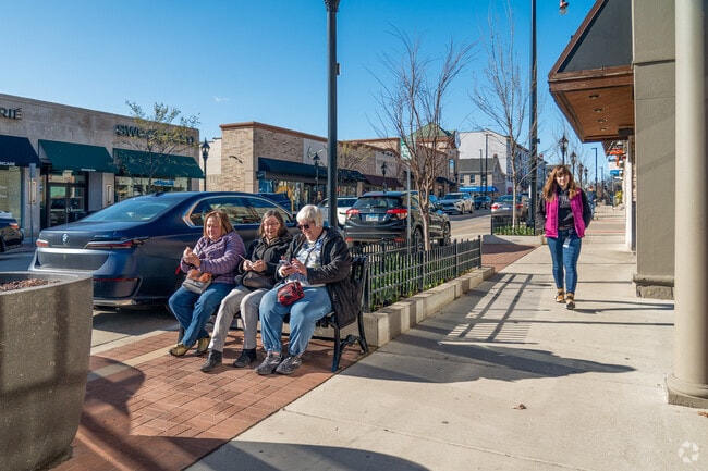Residents enjoy an ice cream treat on Main Street.