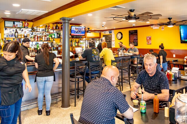 FaxChix Restaurant in Farmingville serves Mexican and Portuguese fare in a bustling space.