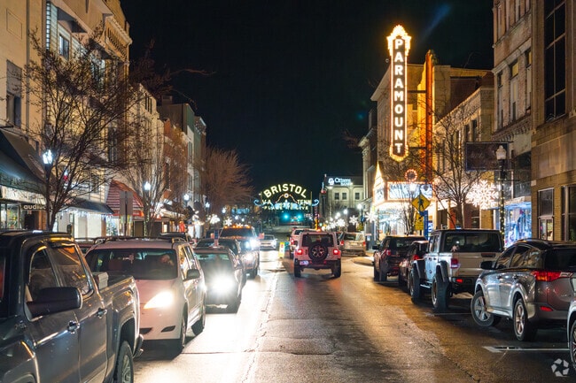 Stroll beneath the glow of streetlamps and the bright lights of the Paramount Theater.