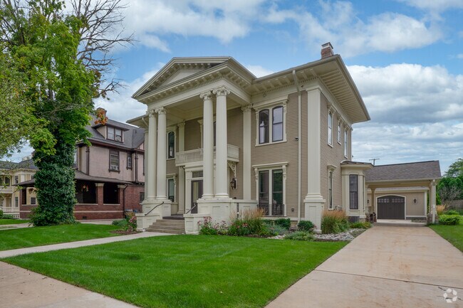 A stately Greek Revival home in the Central Business District is a historic property.