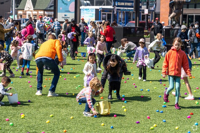 Kids run for eggs during the Easter Egg Hunt at Gallagher Way in Wrigleyville.