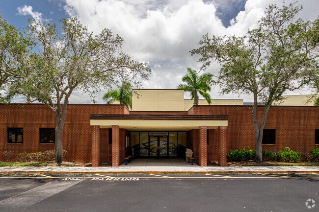 Naples High School welcomes students through the main entrance.