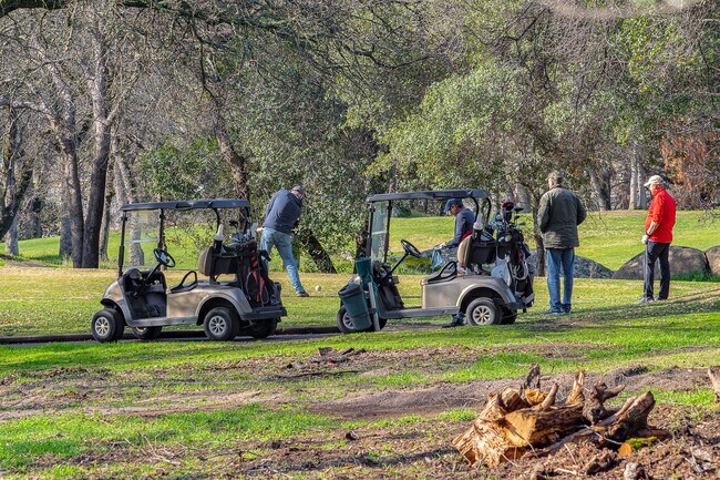 Group of men tee off at Turkey Creek Golf Course in Lincoln.
