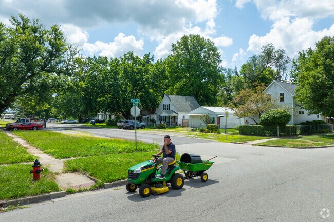 A resident of Pillsbury drives his tractor on the street.