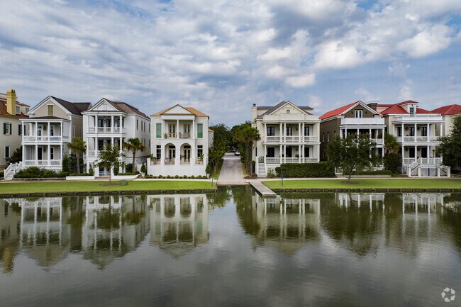 Many I'On homes overlook tranquil lakes with walking paths nearby.