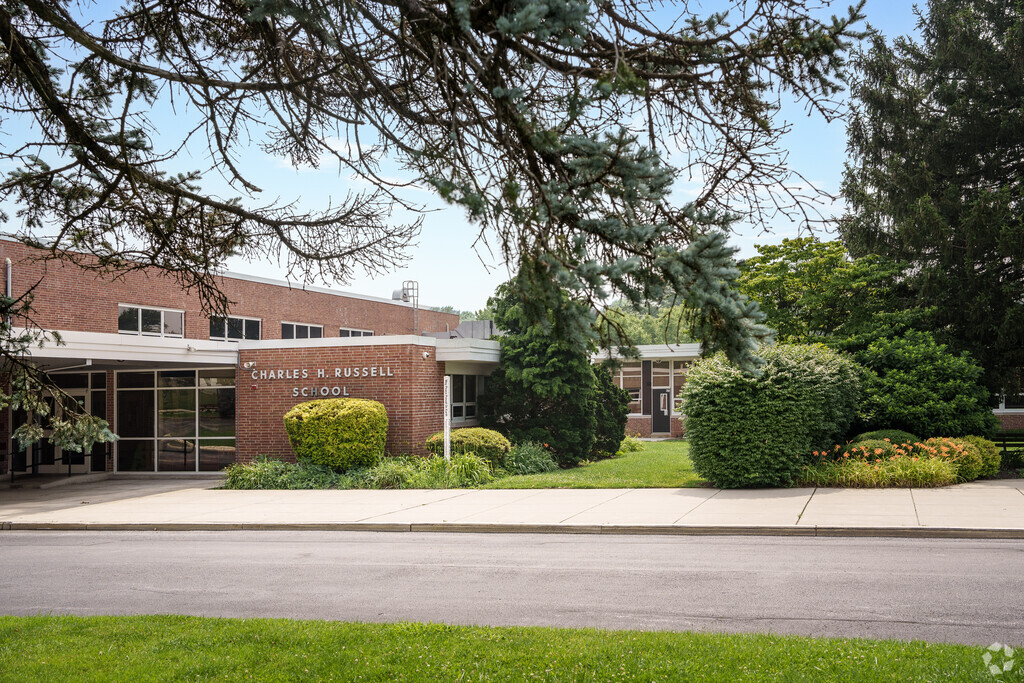 Russell Elementary School is built in a classic, single-story, brick architecture style.