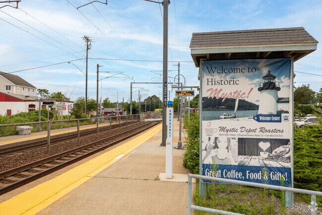 A welcoming sign greets you to Mystic Amtrak Station in Mystic Historic District.