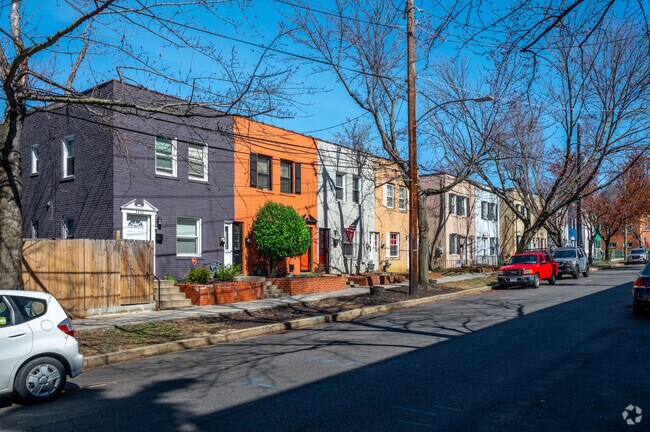 Lines of brightly colored row homes line the streets of the Greenway neighborhood.