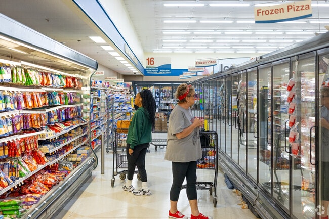 Two shoppers ponder what groceries to buy from the nearby Family Fare.
