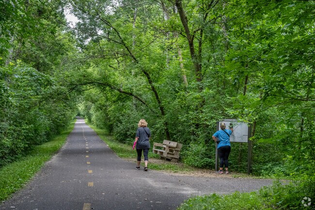 Residents can walk for miles on the trails leading to and from Pine Point Regional Park .