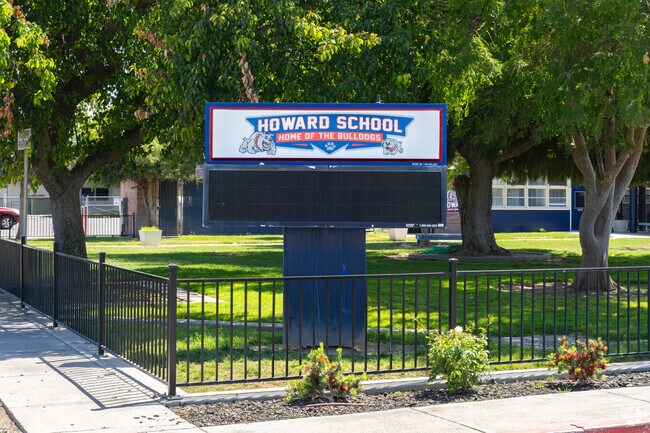 A large lighted marquee outside Howard Elementary School informs parents of events.