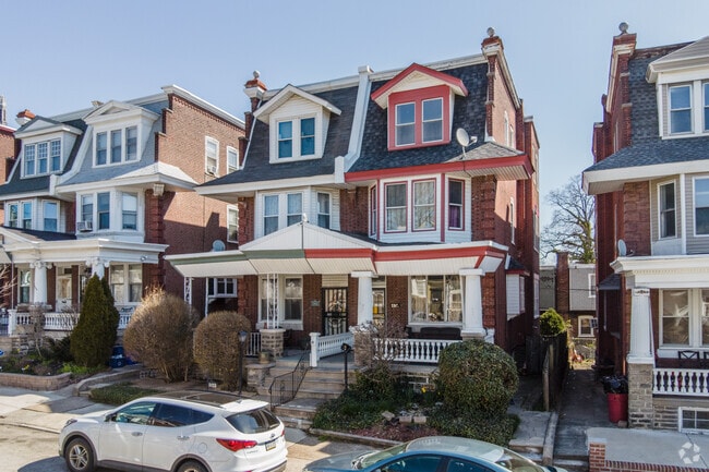 Three-story twin homes with no yards line the streets of this neighborhood.