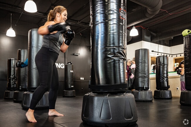 Taking action and dishing out blows at the Puppy Love charity event at iLoveKickboxing.