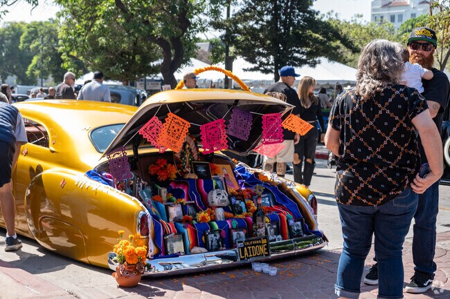 Dia de Los Muertos Art & Music Festival features vibrant altars honoring loved ones.