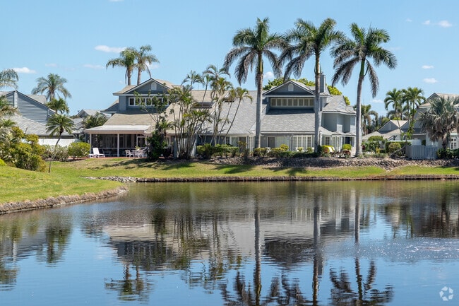 Several of the individual neighborhoods within Pelican Bay have large-waterfront duplex homes like this one