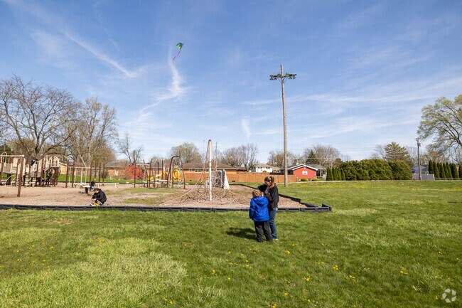 Come to Cooley Park to let the kids play on the playground on a warm spring day.