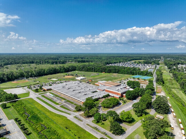 Baseball fields, tennis courts, and a track are for students at the Great Bridge High School.