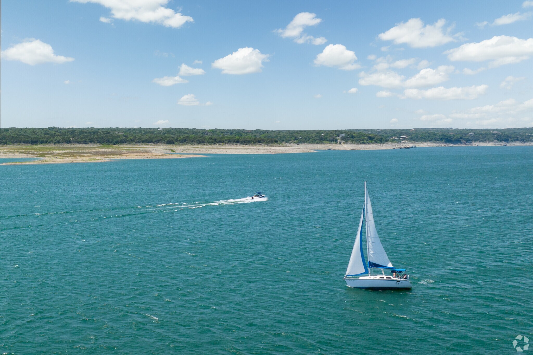 Sail boats enjoying a day on the Colorado River of Lake Travis.