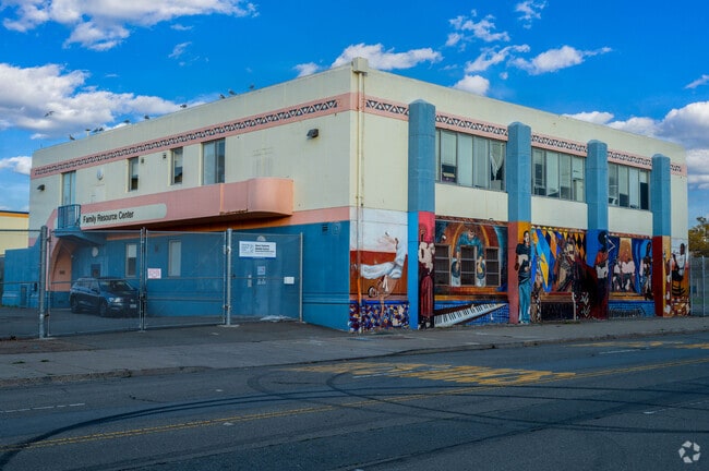 West Oakland Middle School has a vibrant mural painted on the side of the building.