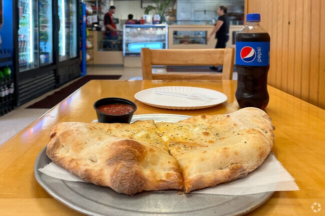 Enjoy a giant calzone at Sal's Pizza, located in the Merrimack neighborhood.