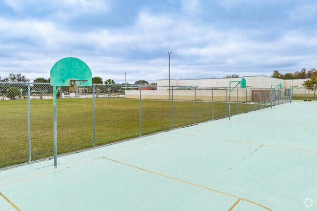 Kids enjoy outdoor play on the sports courts at Davidsen Middle School.