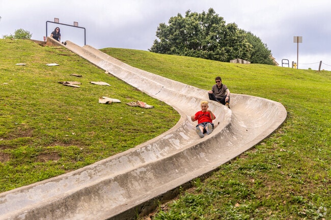 The Coleman Hill Park has a unique concrete slide that residents can use cardboard to slide down in the InTown neighborhood.