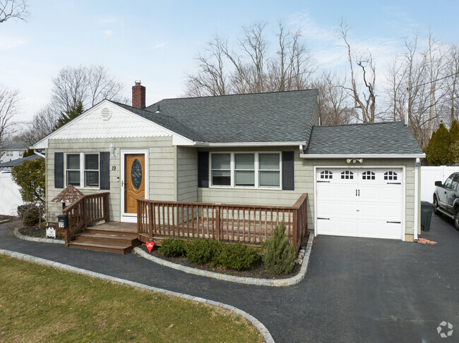 Kings Park has beautiful ranch homes with driveways.
