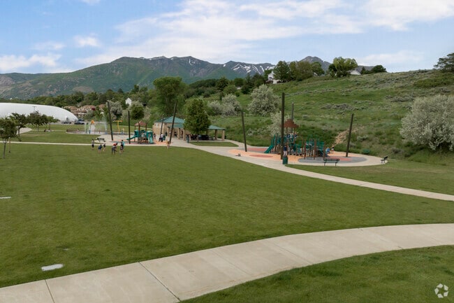 South Ogden Nature Park splash pad, surrounded by grassy lawns, is a great place to cool down.