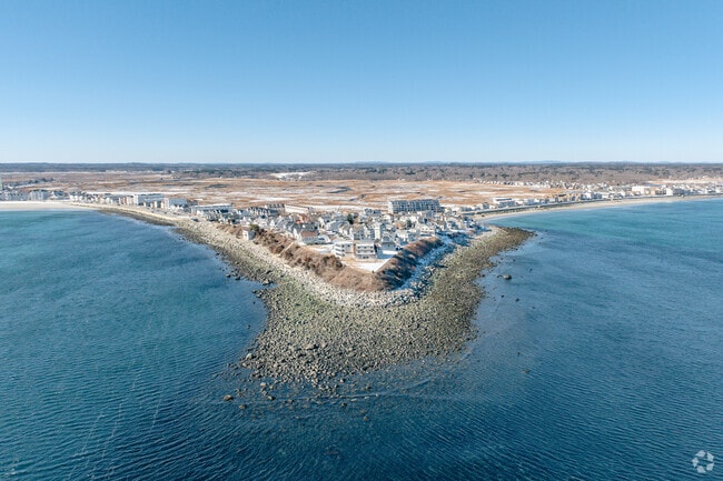 Beautiful cove rock formations line the coast of the Hampton shoreline and many homes reside on the peninsula.