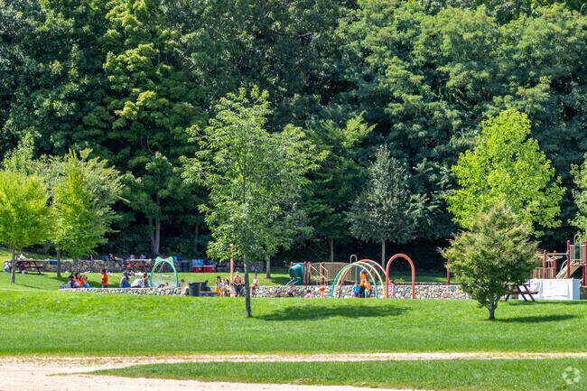 A group of children enjoy the splash pad Swasey Field Park in Haverhill, MA.