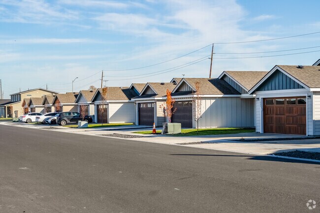 A row of townhomes lines a peaceful street in Cold Springs.