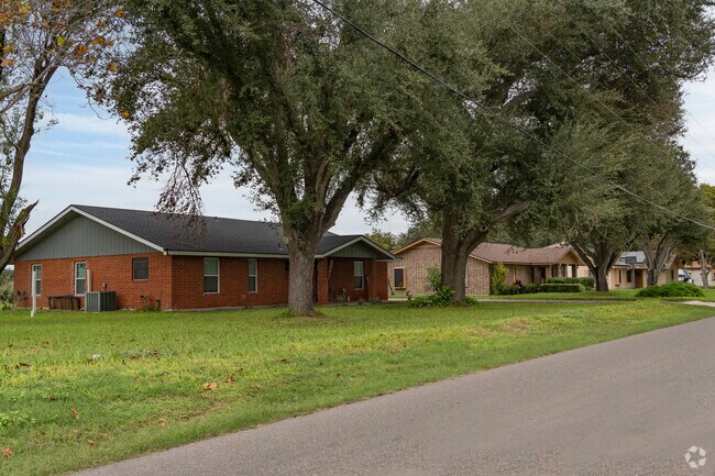 A row of traditional brick style homes located in the east side of Palmhurst, Tx.