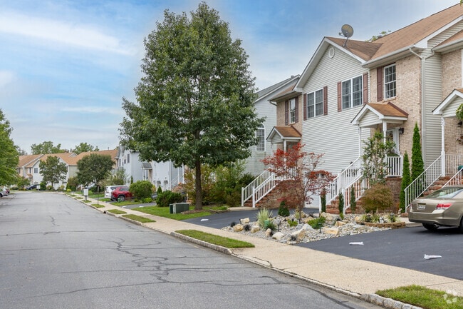 Neighborhoods in Helmetta have tidy lawns and trees along their streets.
