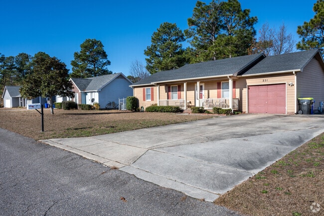 Homes with porches are common in Pine Forest.
