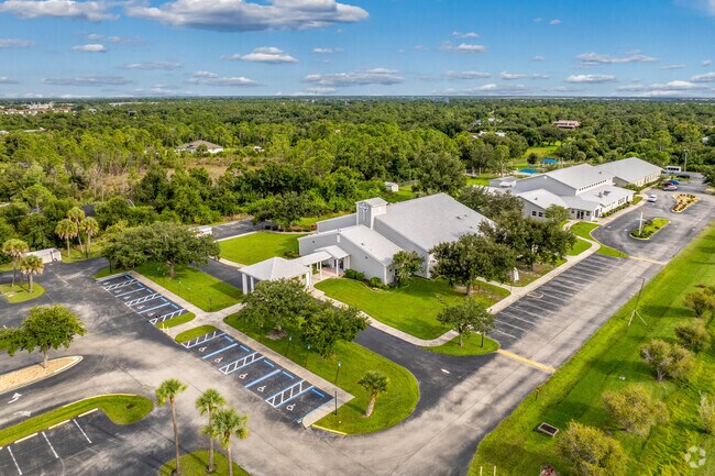 Pilgrim Church sits on a spacious lot in sunny Port Charlotte, FL.