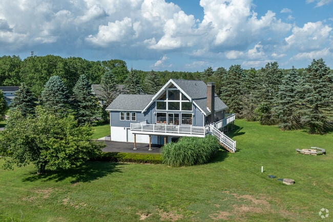 Mountain style chalet homes are built right into the tree line in Penn Forest.