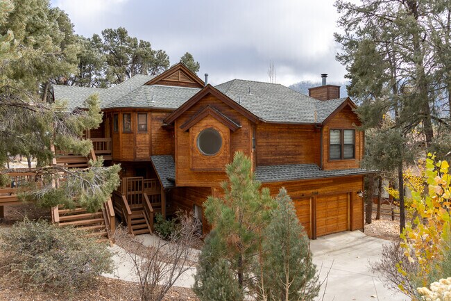 Amongst the trees, a grand custom-built cabin stands tall in Pine Mountain Club.