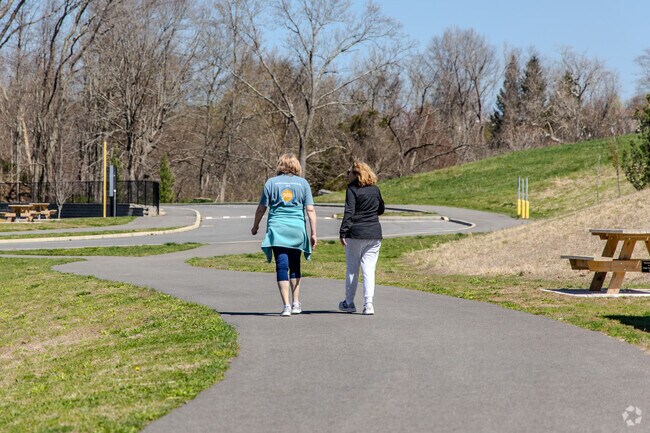 Friends walk and breathe fresh air together in Riverdale, Portland, CT.