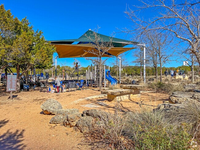 Children enjoy the playground at Blue Hole Regional Park