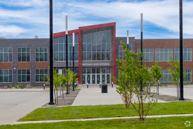 Neenah High School, with its bold red-framed entrance, is part of Neenah Joint School District.