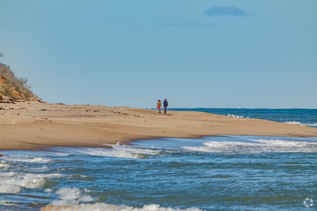 Locals like to stroll the peaceful coastline, soaking in the classic New England beach atmosphere.
