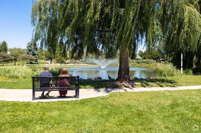 Sit back and relax on the benches overlooking the pond at Nancy Lewis Park.