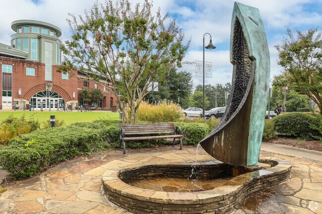 Grab a book and read on the benches by the fountain at Fort Smith Public Library near Hillcrest.